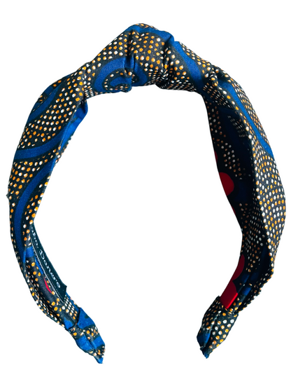 Serre-tête à nœud en wax "Spirales bleues et fleurs rouges"